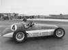 Prince Bira of Siam Driving a Maserati 4CLT/48